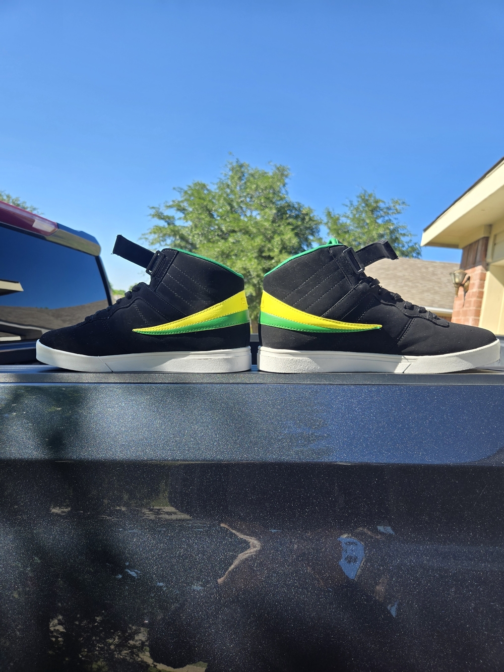 FILA Black High Top Sneakers with Green and Yellow Accents - Picture 2 of 13